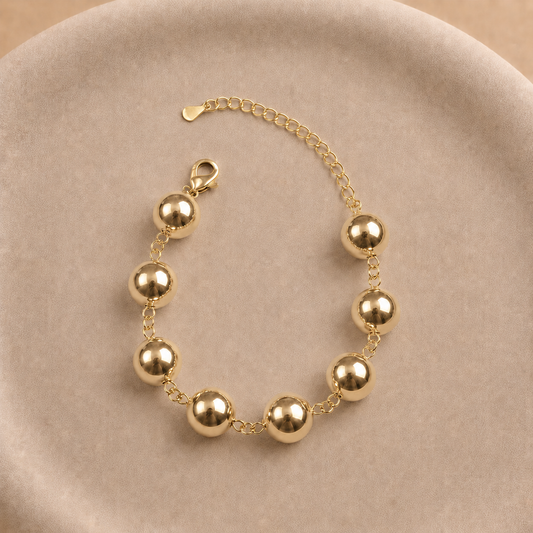 Pulsera de esferas lisas 12 mm bañada en oro ajustable 24 cm