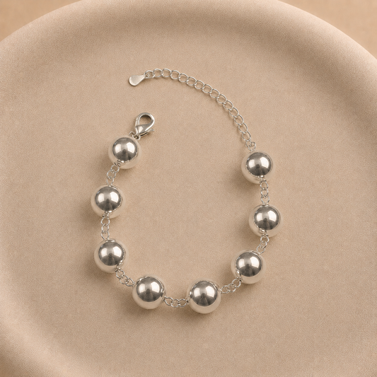 Pulsera de esferas lisas 12 mm bañada en plata ajustable 24 cm